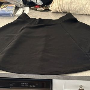 BNWOT black mini skirt by H&M divided in size large